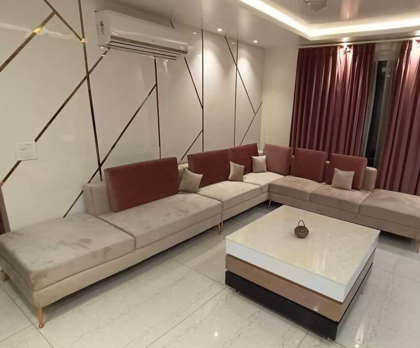 Beige and maroon sectional sofa after professional sofa cleaning in Ludhiana