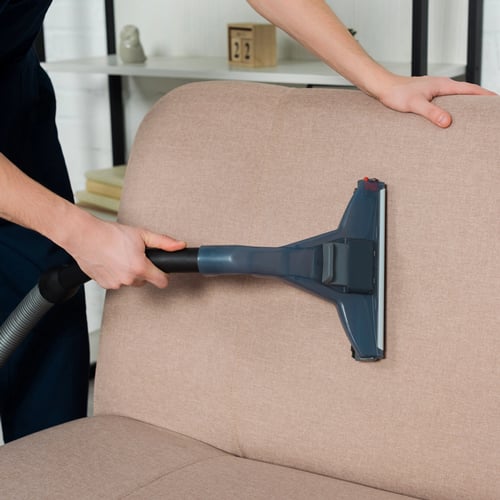Professional sofa cleaning in Ludhiana — vacuum extraction on a fabric sofa